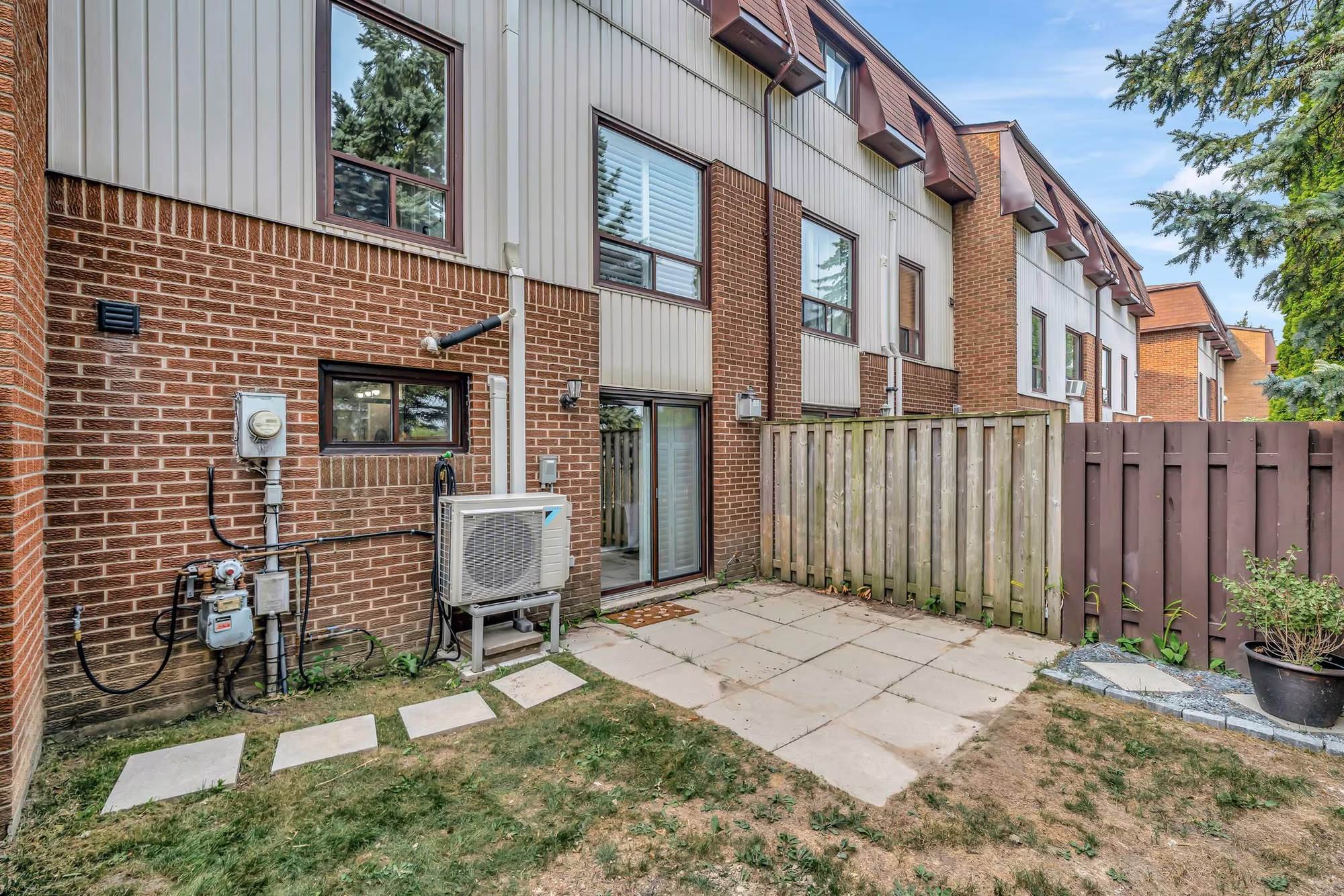 Private fenced backyard at 10-765 Oklahoma Dr, Pickering, with a patio