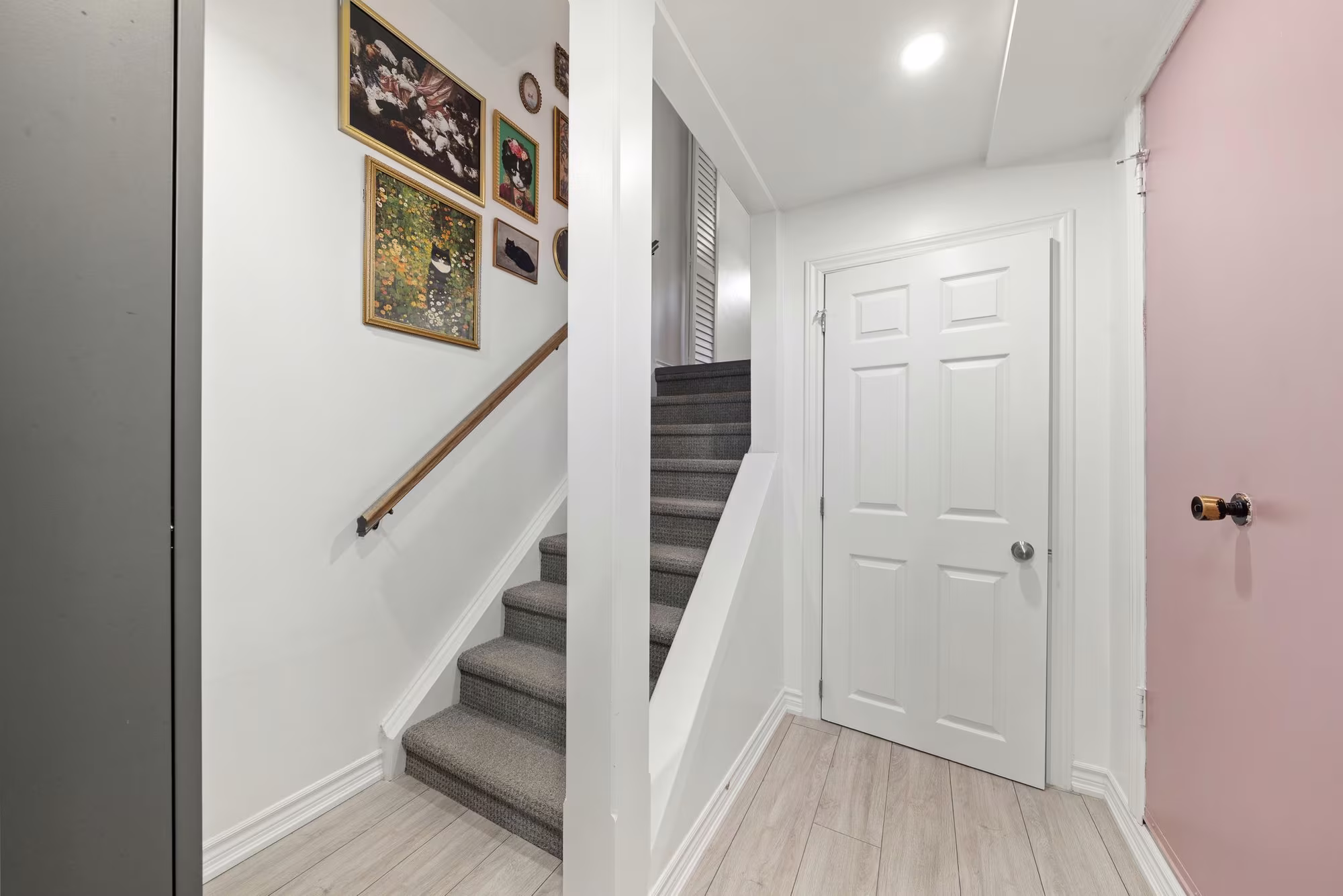 Lower-level landing at 10-765 Oklahoma Dr, Pickering, with garage access and built-in storage