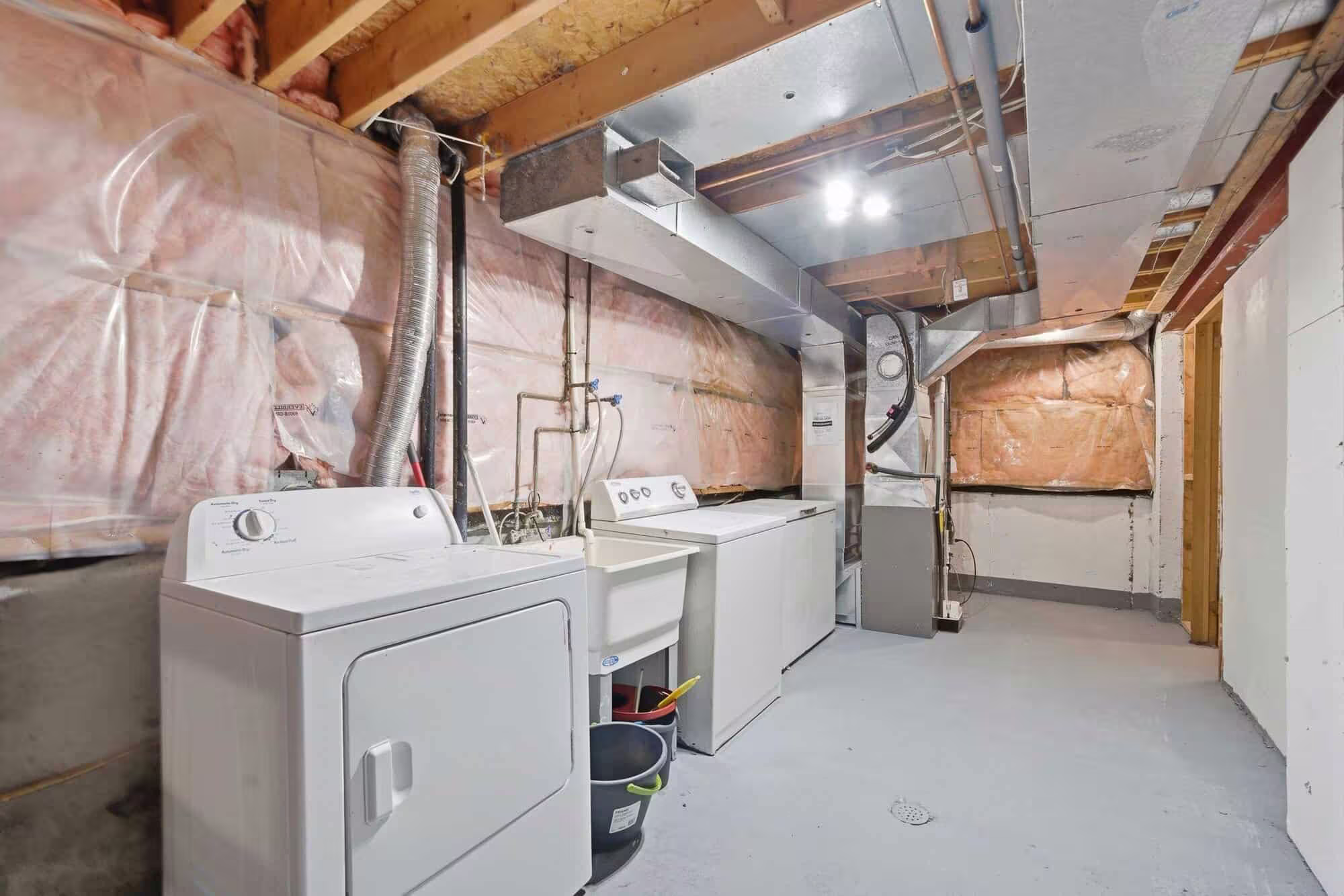 Basement laundry area at 13 Rollo Drive, South East Ajax