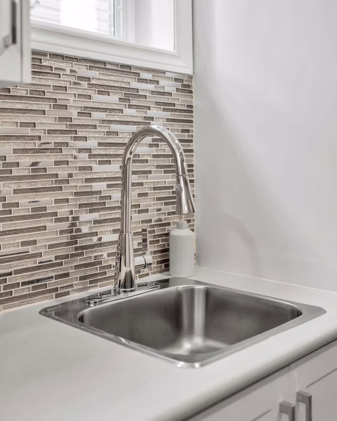 Basement kitchenette sink and backsplash detail at 14 Sleepy Hollow Place, Whitby