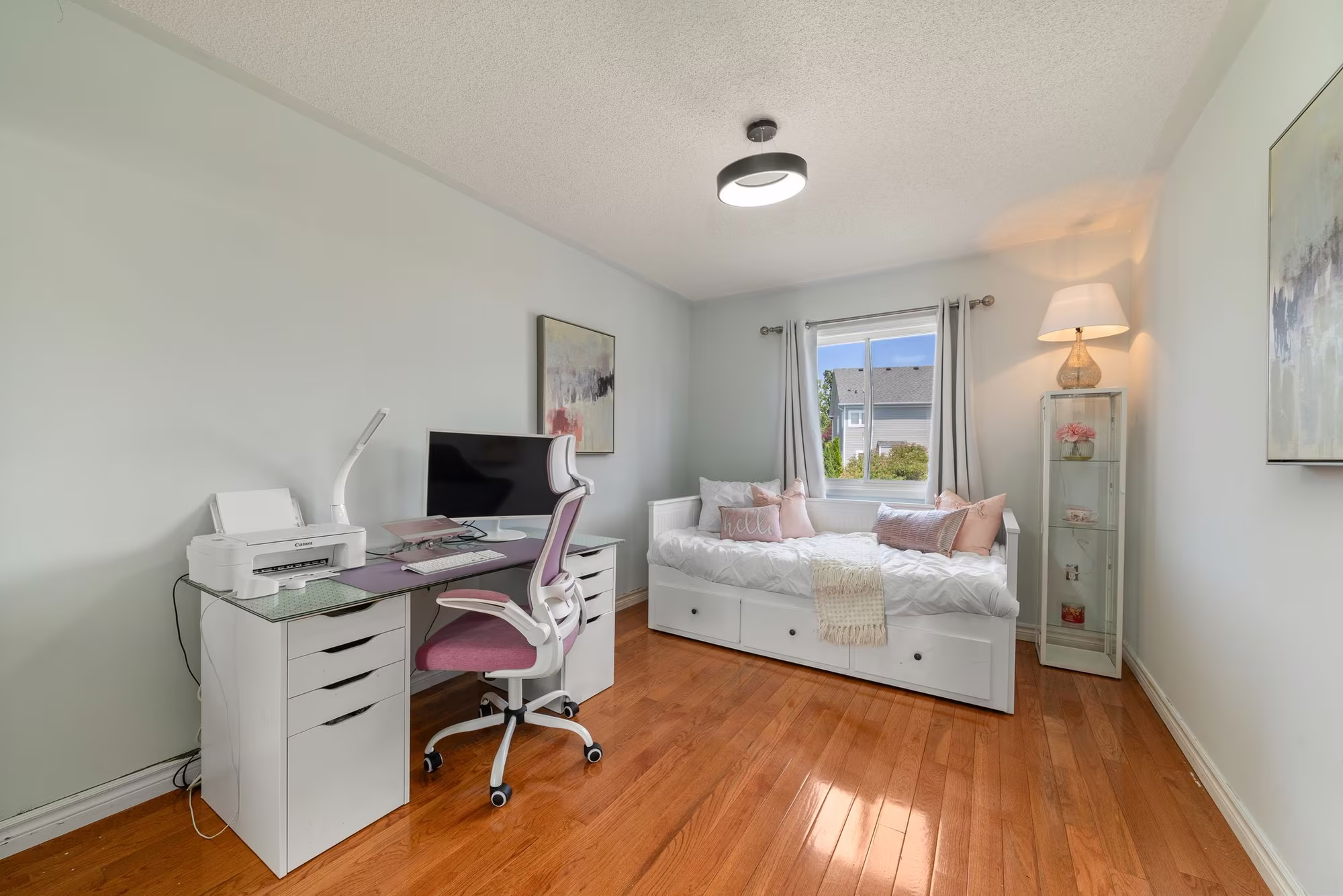 Third bedroom at 1509 Grandview Street North, Oshawa, with hardwood floors and a mounted television