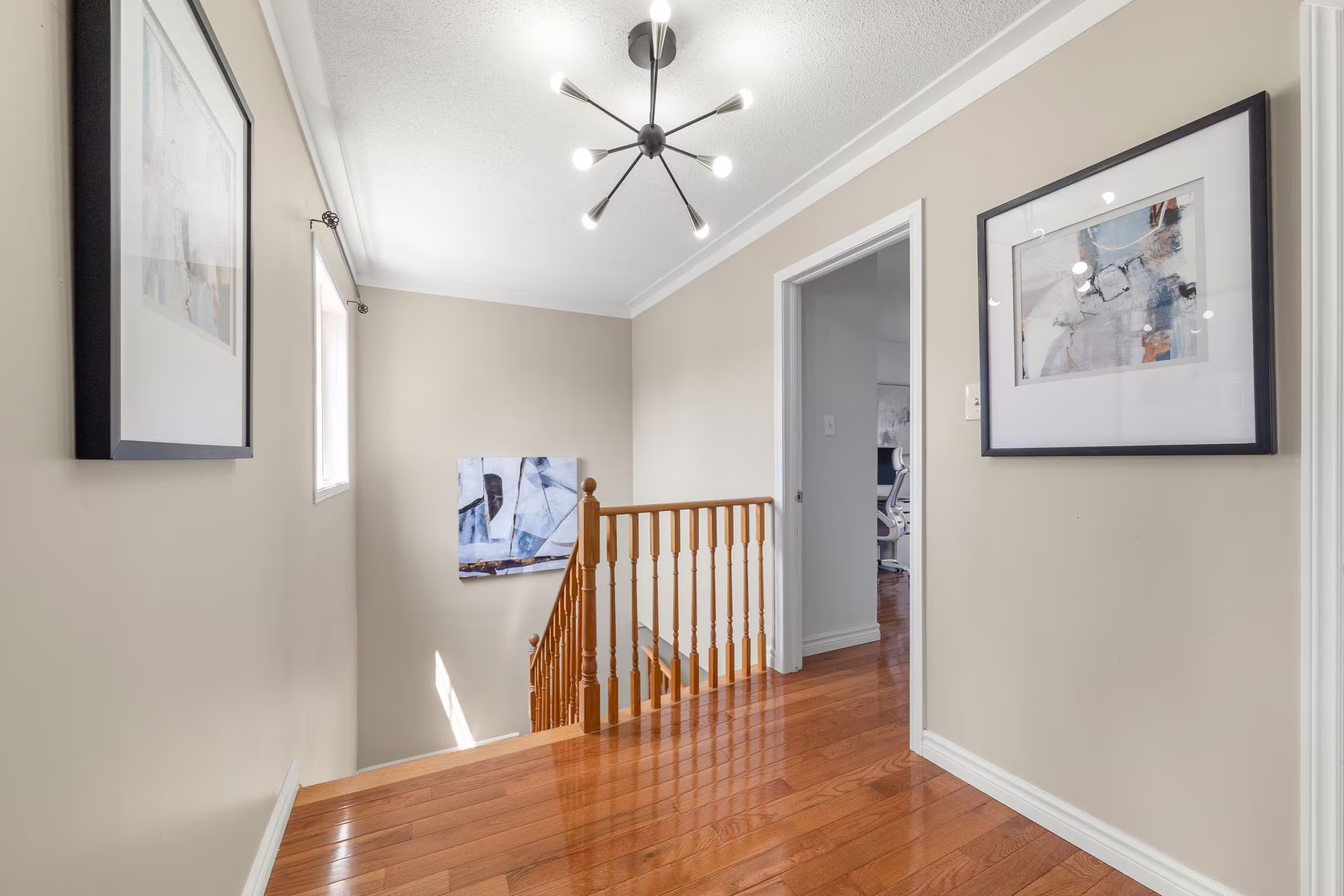 Upper landing at 1509 Grandview Street North, Oshawa, with hardwood floors and a wide layout