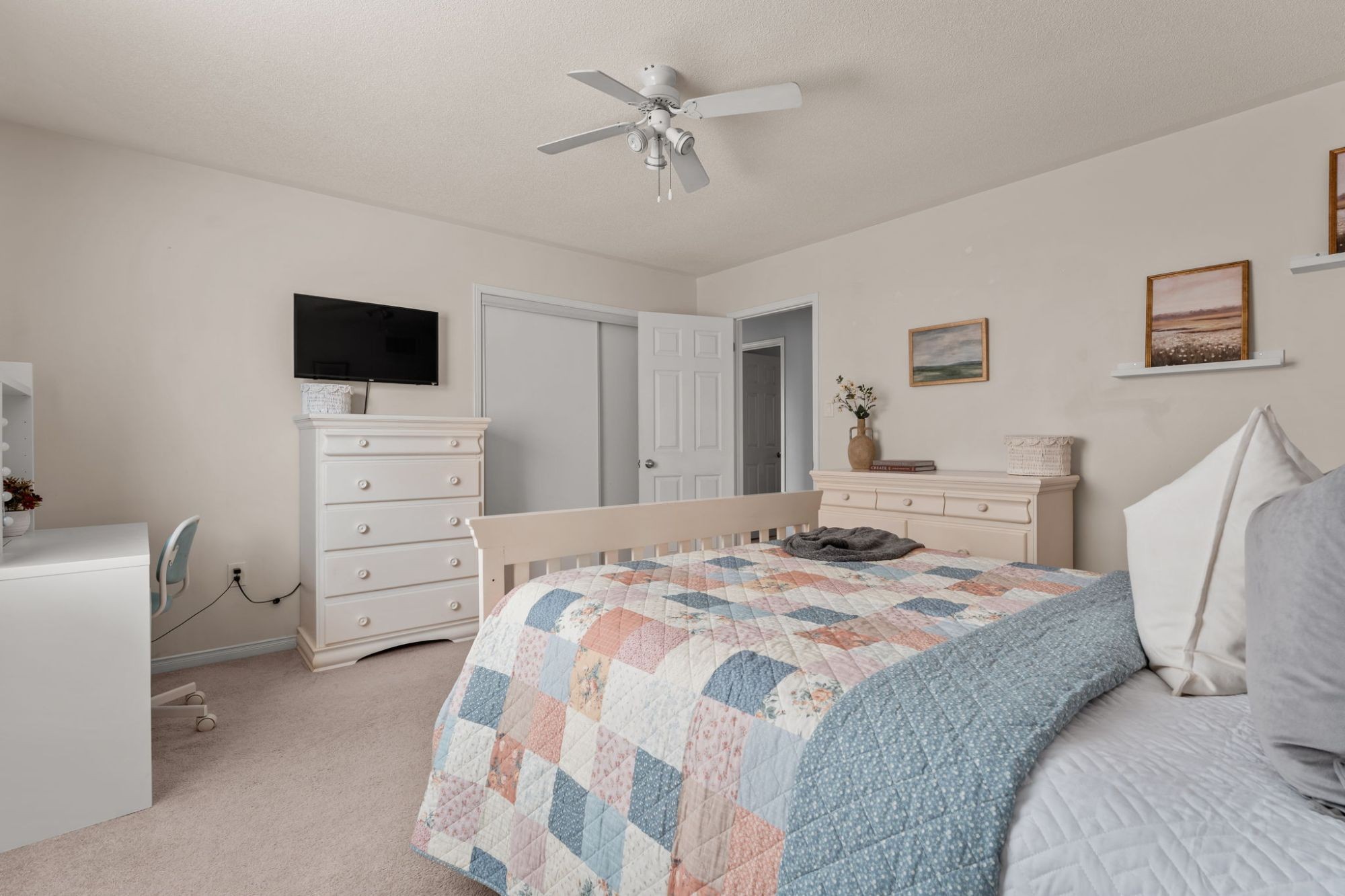 Second bedroom at 1683 Finkle Drive, Oshawa, with a TV dresser, closet and desk