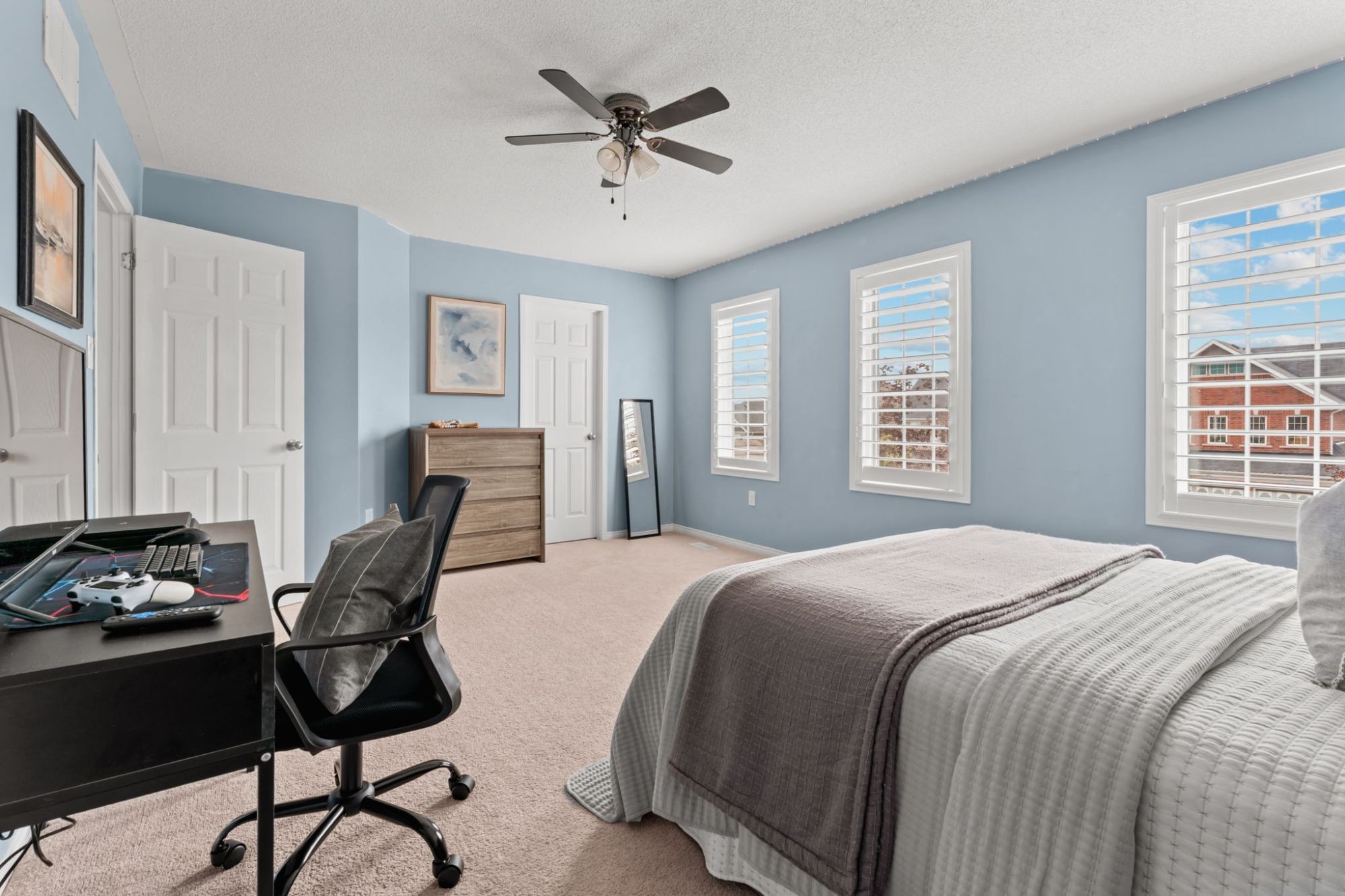 Third bedroom at 1683 Finkle Drive, Oshawa, showing the dresser, mirror and desk area