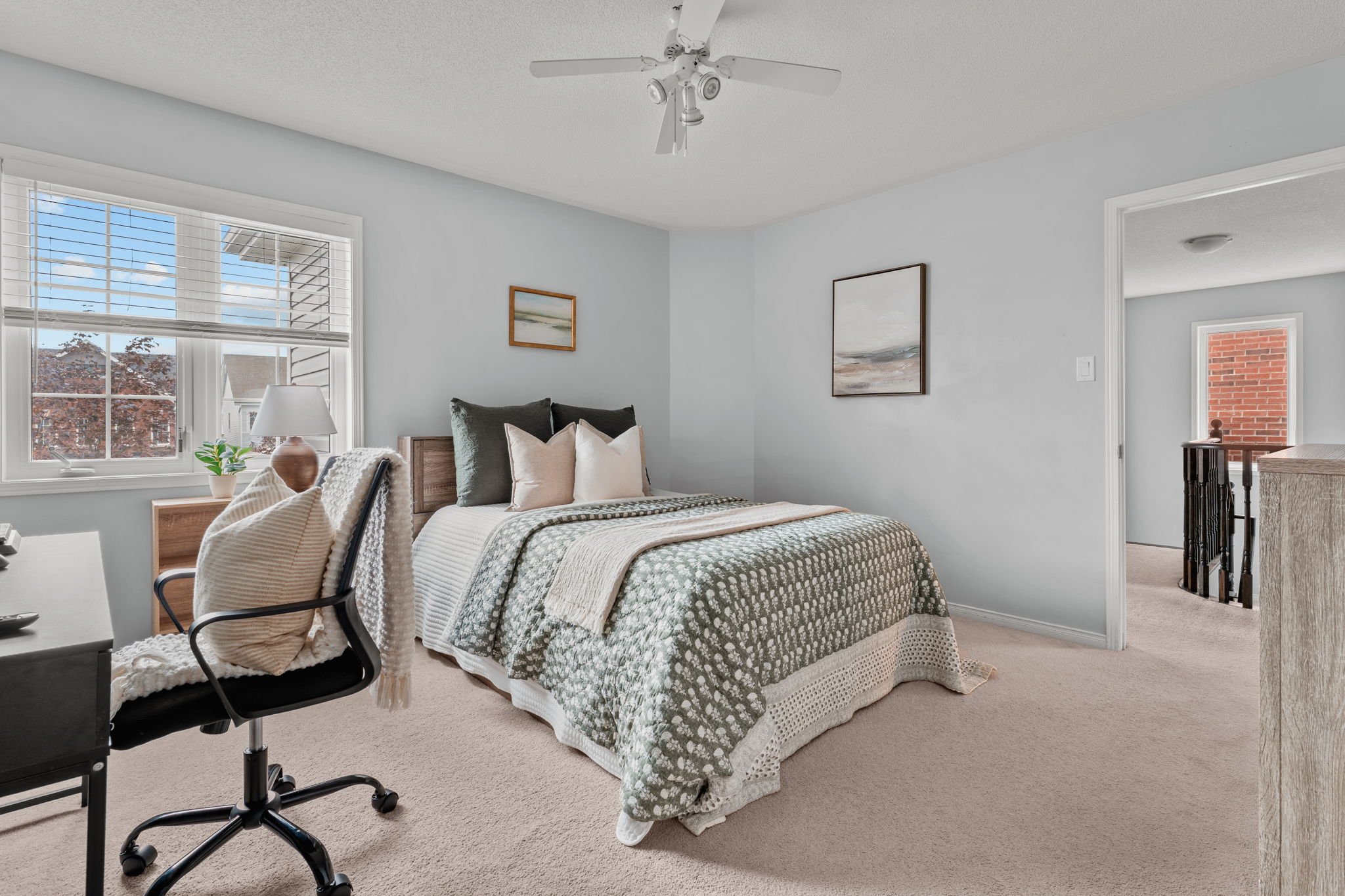 Fourth bedroom at 1683 Finkle Drive, Oshawa, with a TV dresser, closet and desk area