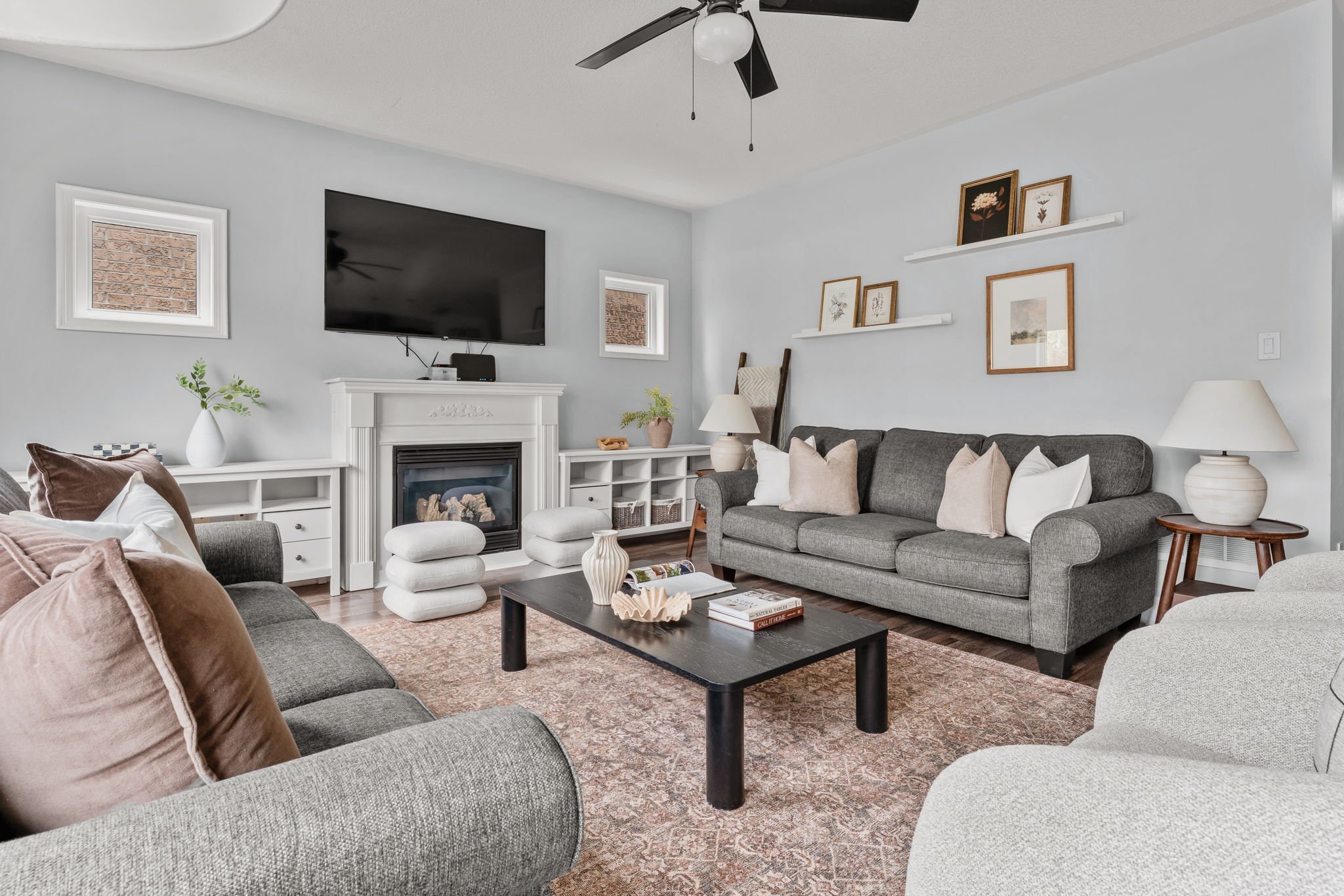 Family room at 1683 Finkle Drive, Oshawa, open to the kitchen, with a gas fireplace and mounted television