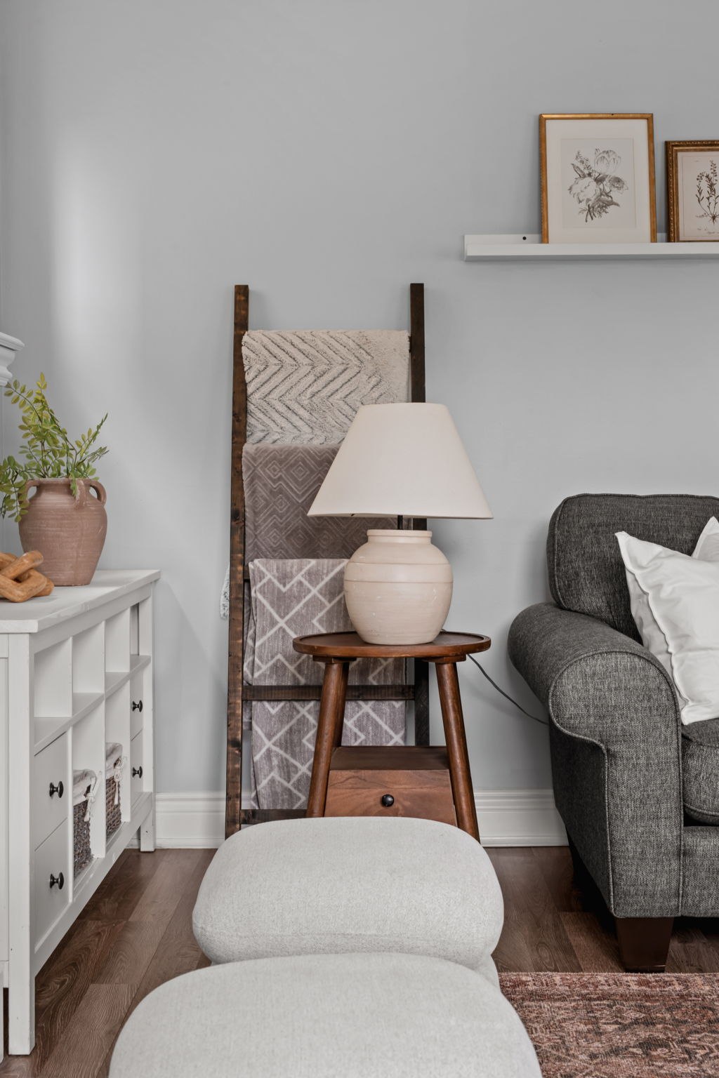 Family room corner styling detail at 1683 Finkle Drive, Oshawa, with a blanket ladder and accent lamp
