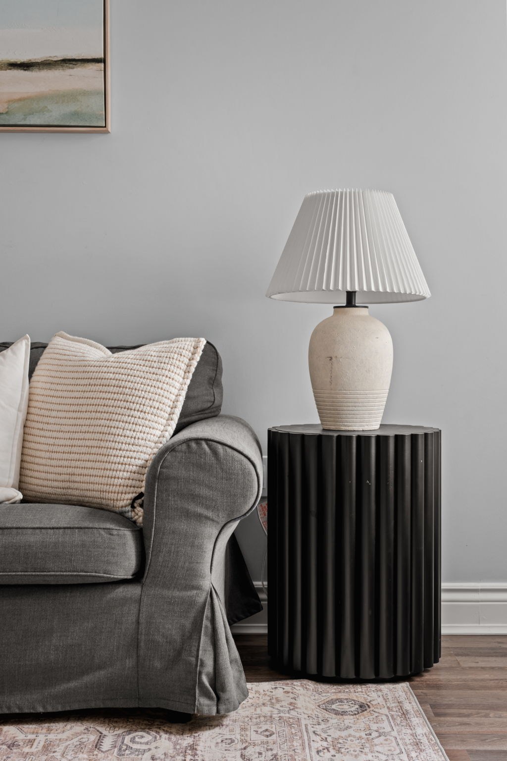 Living room side table styling detail at 1683 Finkle Drive, Oshawa, with a fluted accent table and ceramic lamp