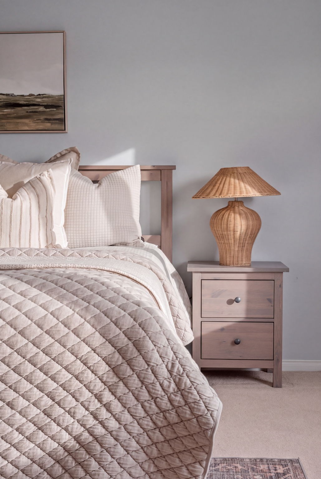Primary bedroom nightstand detail at 1683 Finkle Drive, Oshawa, with a woven table lamp and landscape artwork