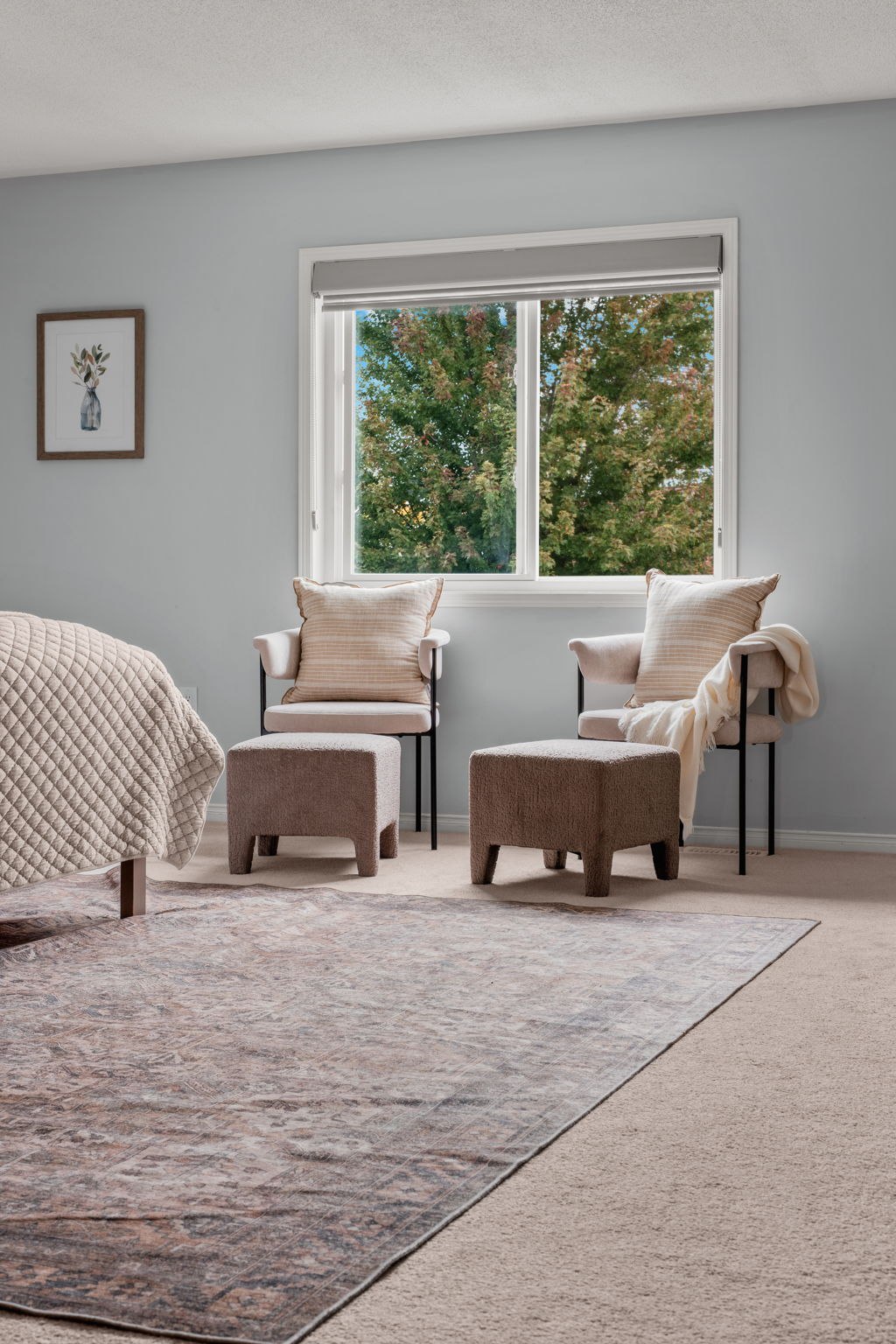 Primary bedroom sitting area at 1683 Finkle Drive, Oshawa, with two accent chairs and ottomans by the window