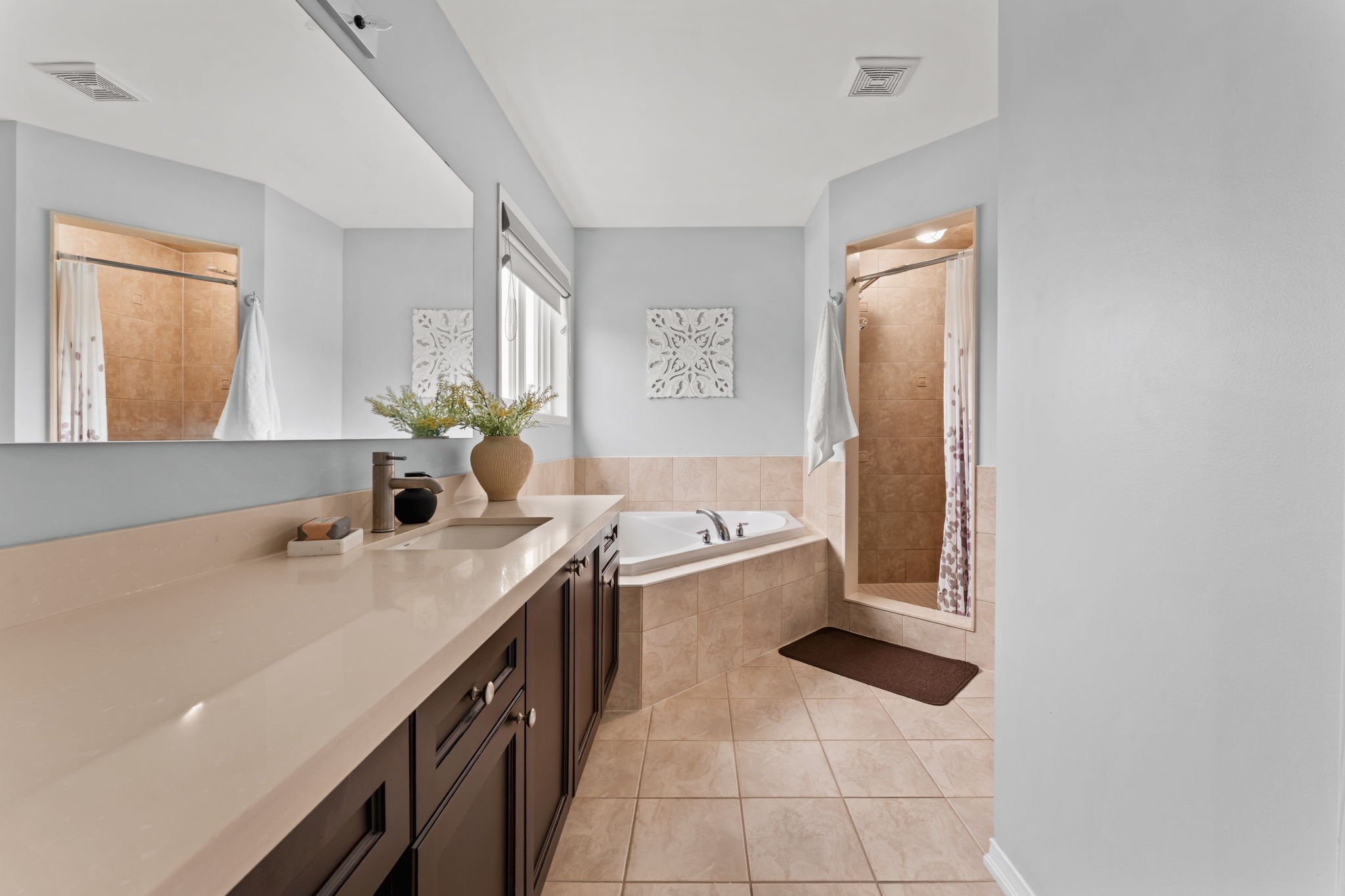 Primary ensuite at 1683 Finkle Drive, Oshawa, with a soaker tub, separate glass shower and long vanity