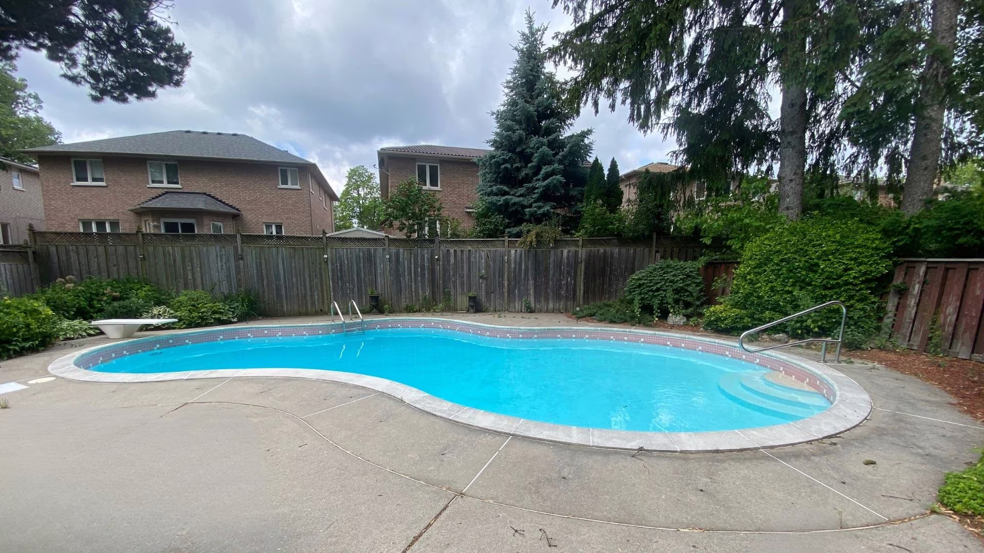 Heated inground pool in the fenced backyard at 38A Deep Dene Dr, Highland Creek Village