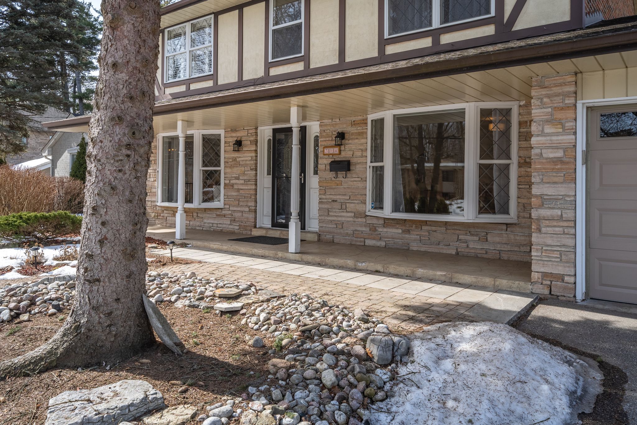a house with a tree in front