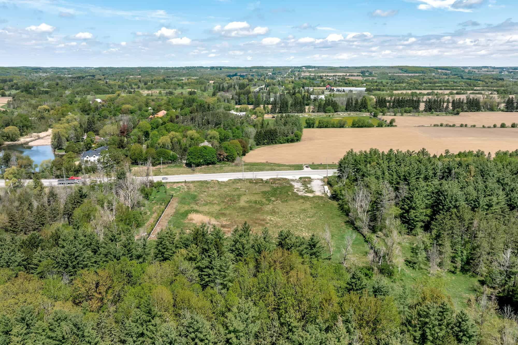 Aerial view of 3187 Stouffville Rd showing HC-zoned land bordered by forest and farmland near Bruce’s Mill Conservation Area