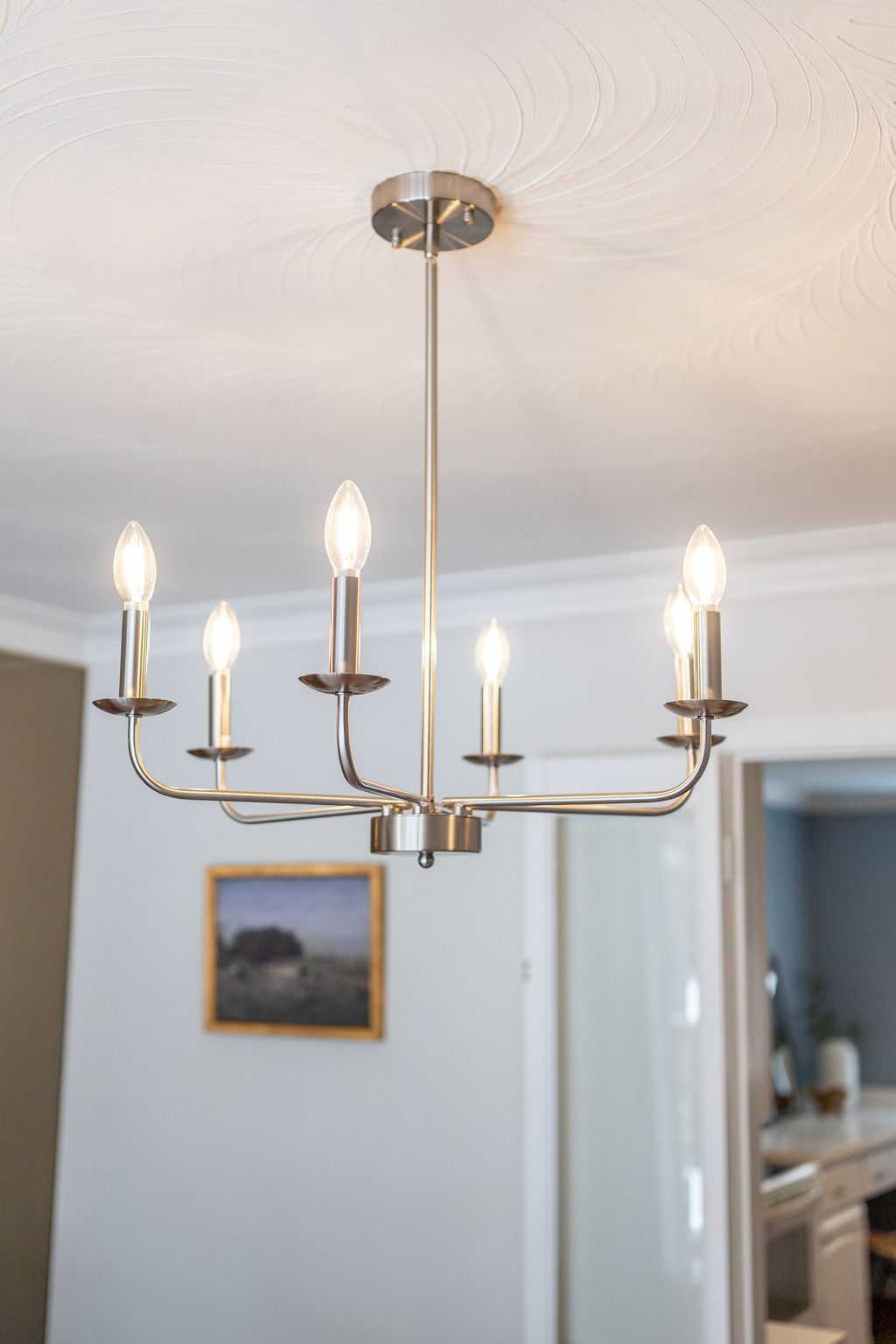 Close up of chandelier at 38A Deep Dene dining room