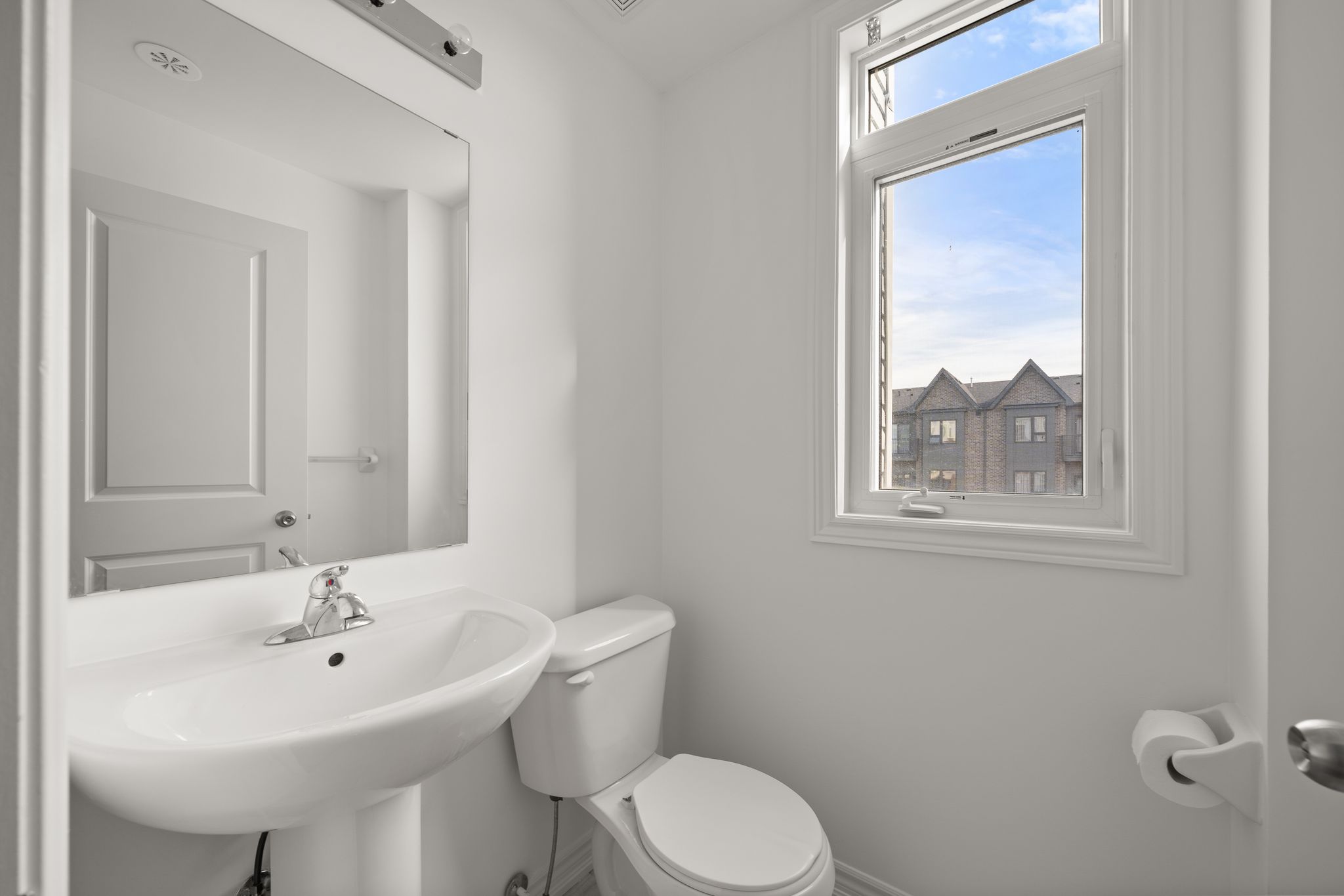 Modern bathroom with vanity and bright window at 2598 William Jackson Dr Pickering.