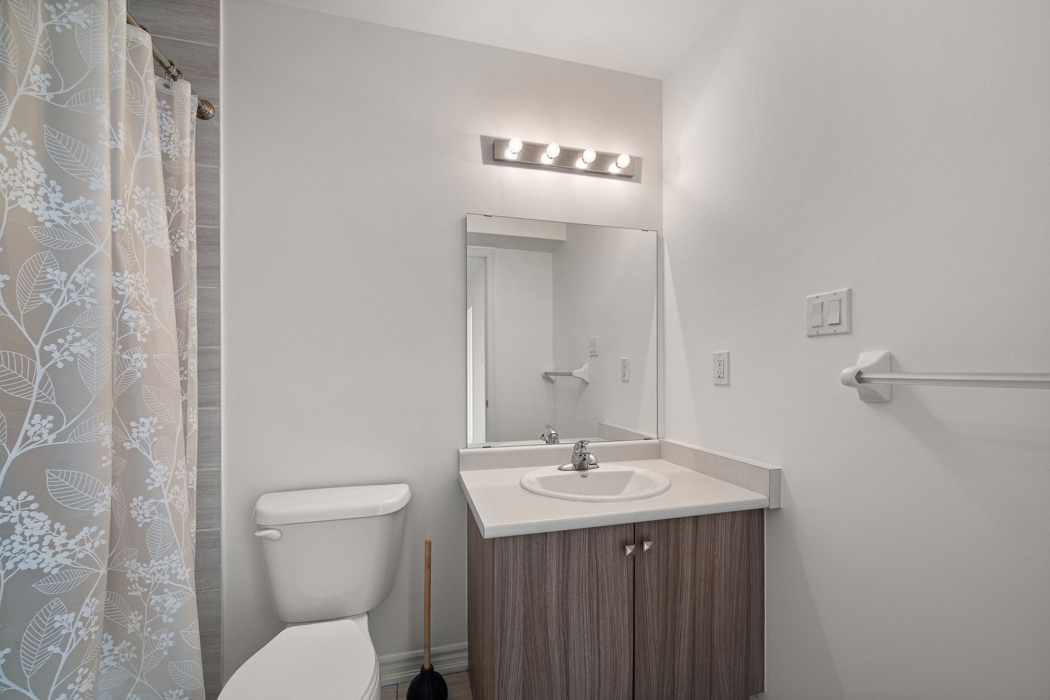 Modern bathroom with vanity and bright window at 2598 William Jackson Dr Pickering.