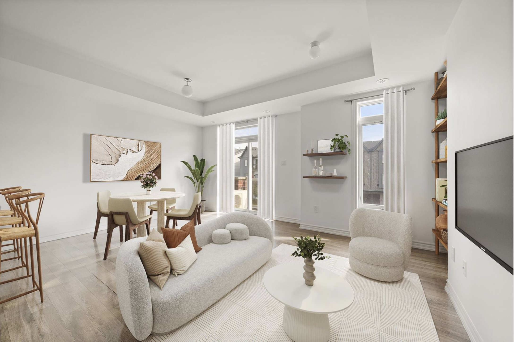 Open-concept living space at 14 Sleepy Hollow Place in Whitby, showing the living room with neutral furnishings, kitchen with maple cabinets and granite counters, and dining area with chandelier lighting.