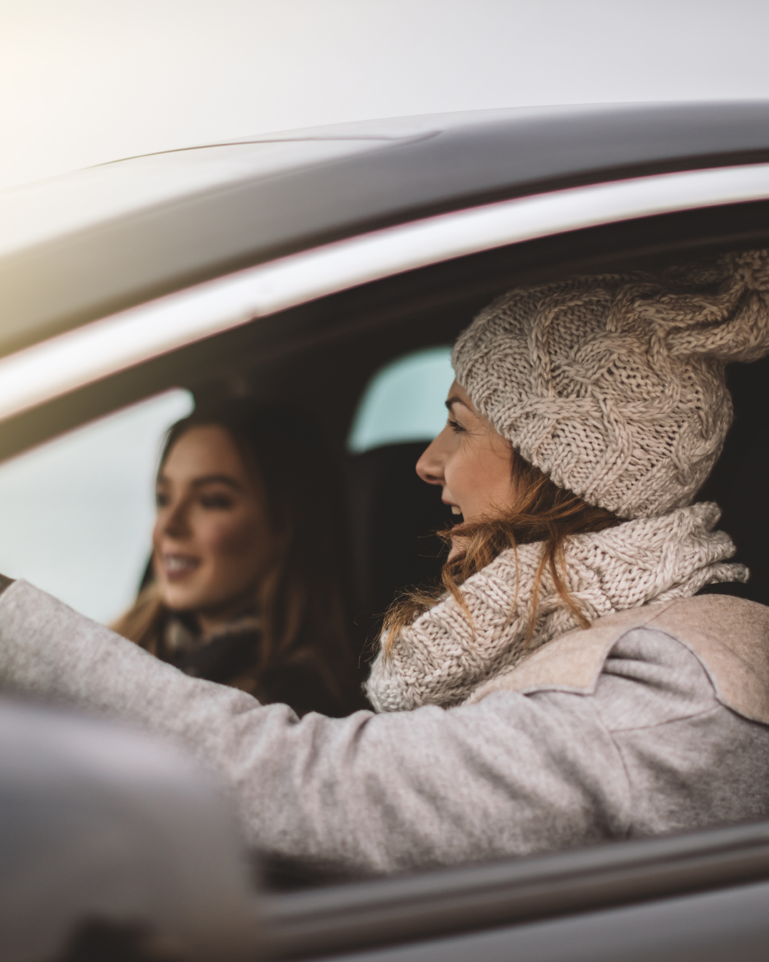 Two friends driving together to view homes as first-time co-buyers in Ajax, Ontario.