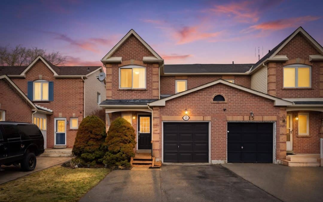 Twighlight image of 13 Rollo Drive Ajax Real Estate. With warm lit windows and a welcoming vibe