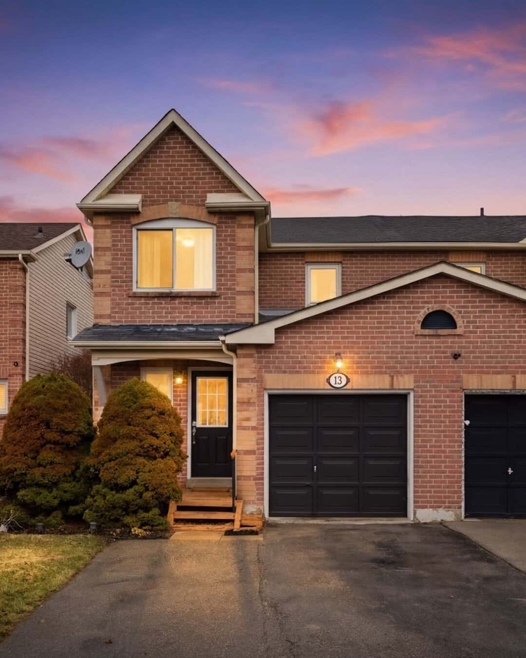 Twighlight image of 13 Rollo Drive Ajax Real Estate. With warm lit windows and a welcoming vibe
