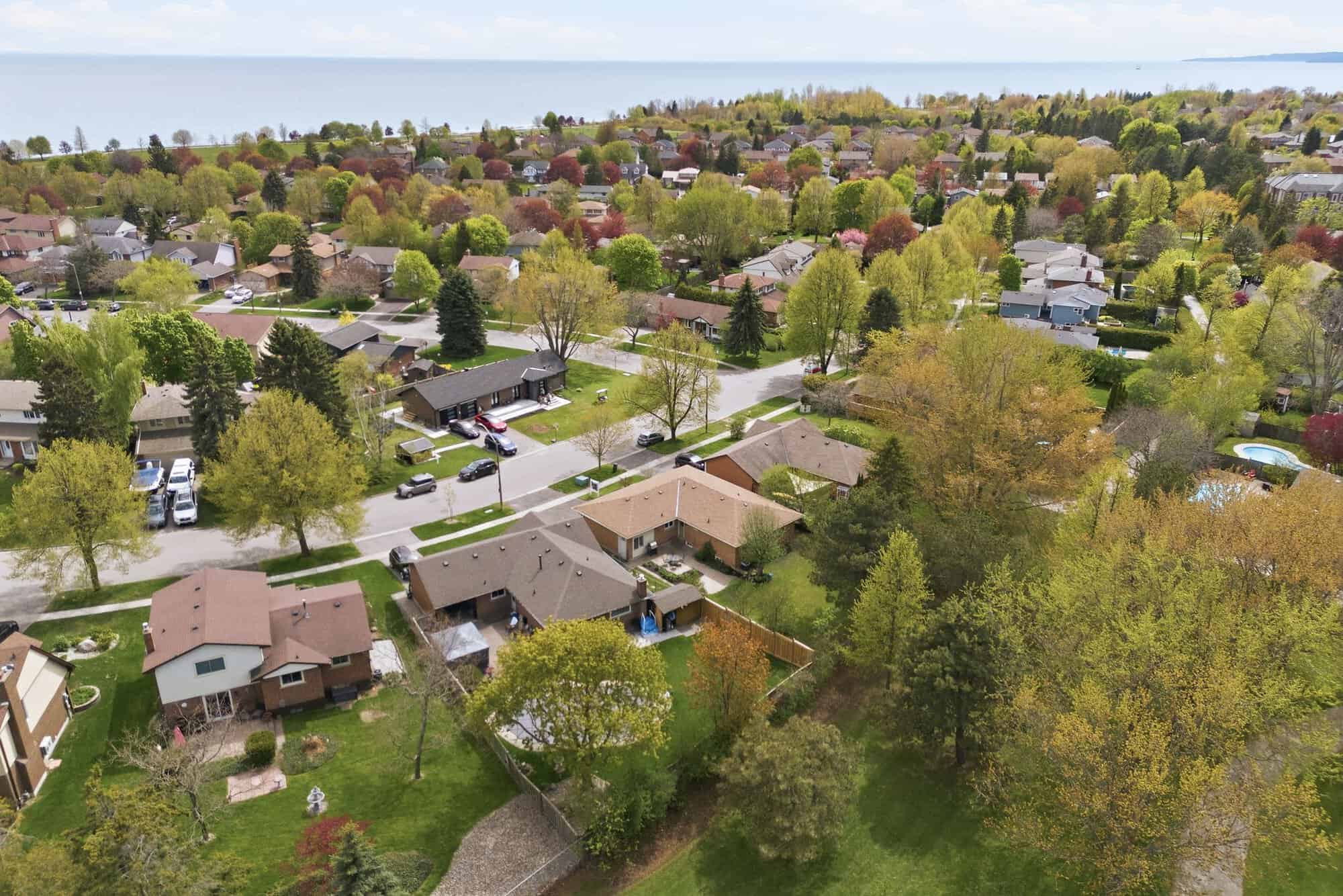 Aerial view of South Ajax near 39 Anstead Crescent, showing residential streets, mature trees, and Lake Ontario.