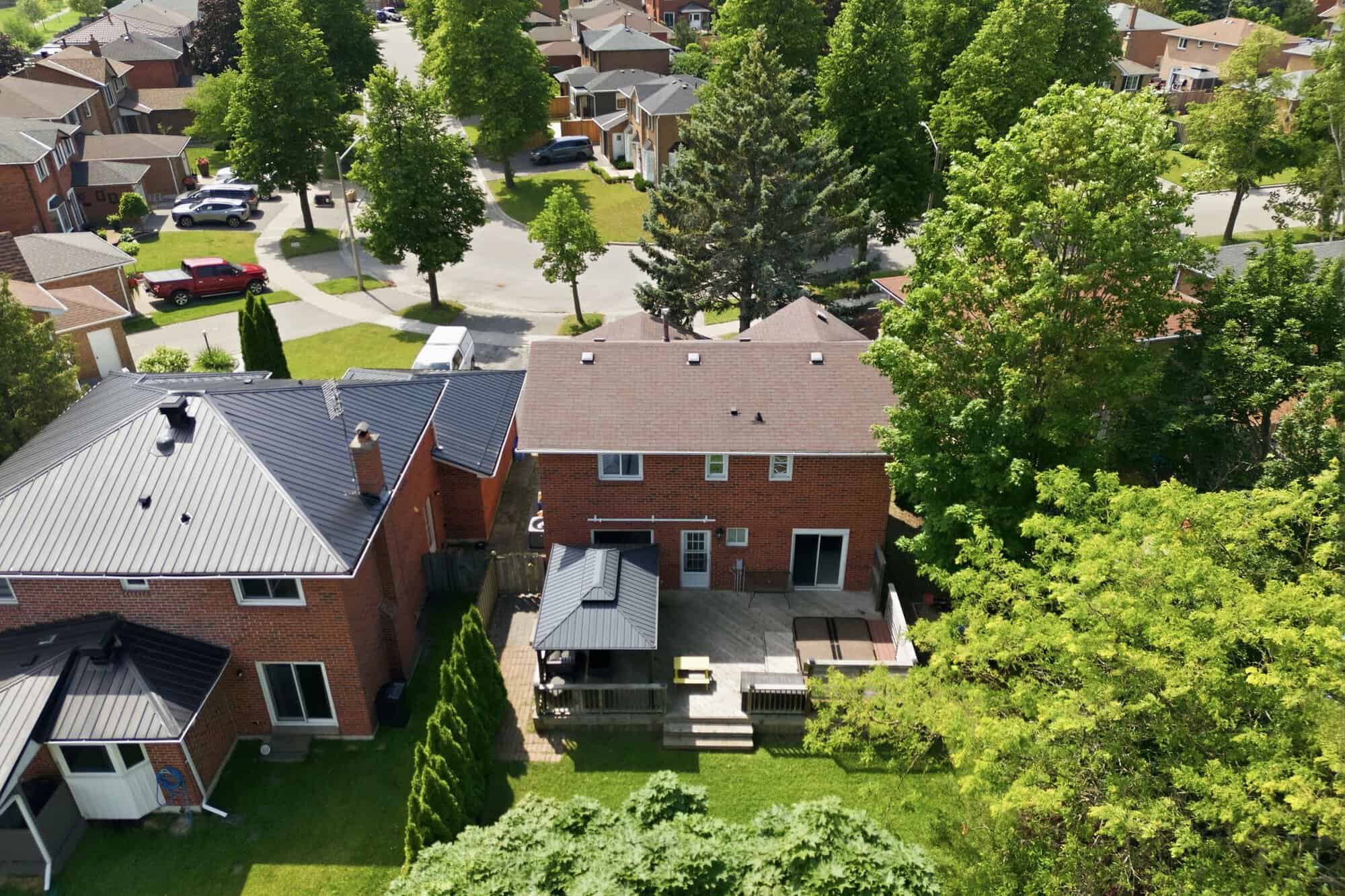 Aerial view of South Ajax near 39 Anstead Crescent, showing residential streets, mature trees, and Lake Ontario.