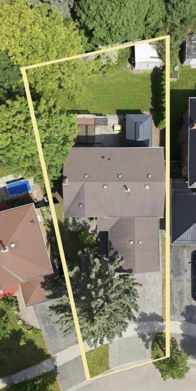 Aerial view of 13 Flowers Crescent in Ajax showing the home, driveway, backyard and approximate lot boundaries outlined in yellow.