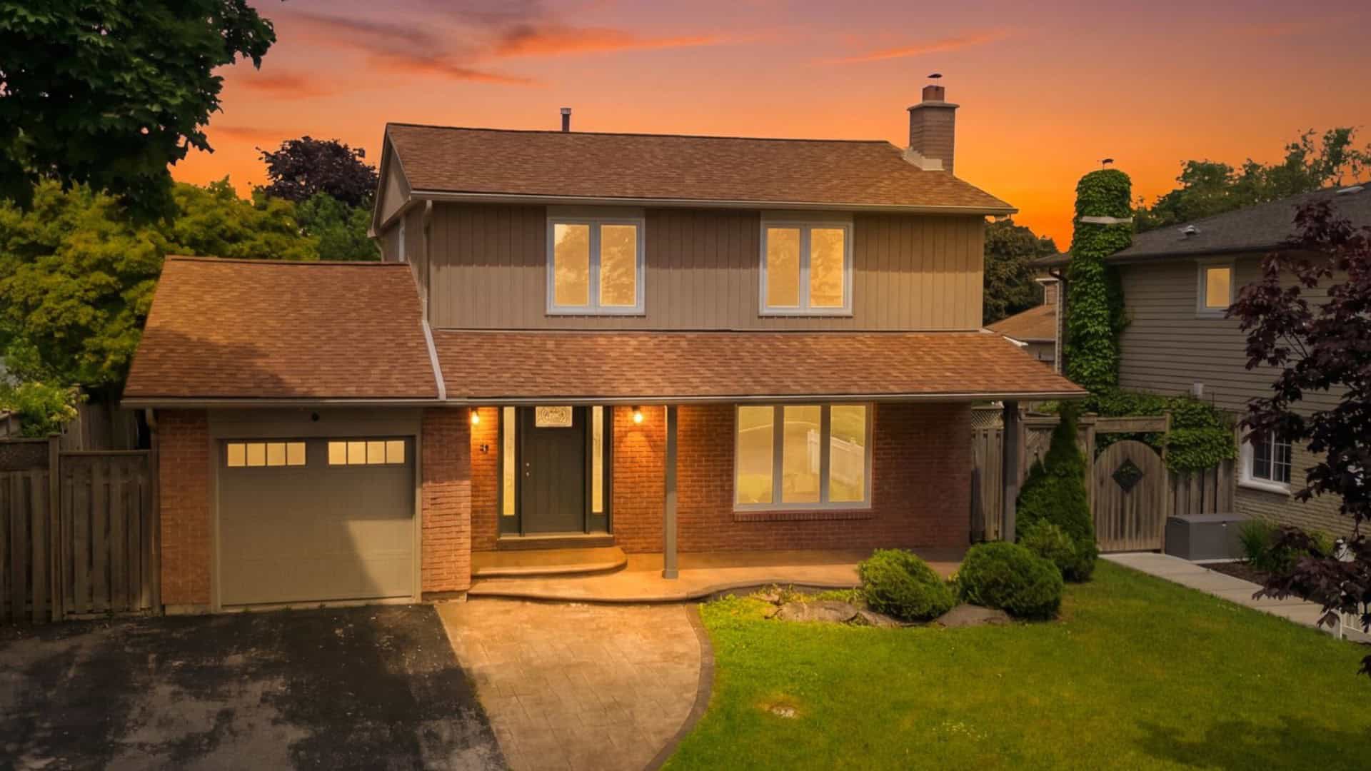 Twilight image of 96 Bolland Cres a renovated family home for sale in south west Ajax by the lake